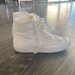 White high-top Nike Blazers